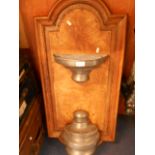 A 19th C pewter water cistern mounted on an oak panel