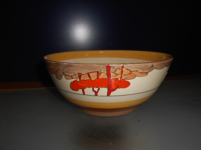 A Clarice Cliff Bizarre bowl decorated with stylized trees  Very minor paint loss