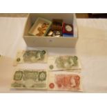 A box of assorted coins and British bank notes