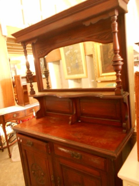 A late Victorian walnut sideboard,