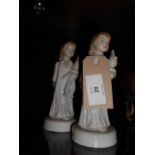 A pair of Royal Dux figures of young girls with clowns,