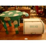 A painted frog stool together with a bread bin