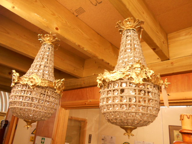 A pair of French style brass and lustre hung bag lights