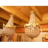 A pair of French style brass and lustre hung bag lights