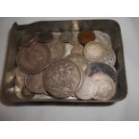 A tin of assorted silver coins to include one shilling, Victorian crowns, half-crowns,