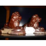 A pair of 19th C salt glazed recumbent lions A/F