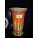 A Shelley green orange and brown glazed slip-ware footed vase
