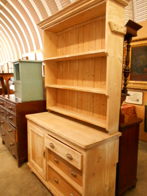 A late Victorian stripped pine dresser,