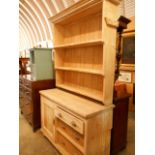 A late Victorian stripped pine dresser,