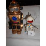 A Botoy Forcebot robot battery operated and a Japanese Tonto robot