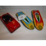 Three 1960's tin plate cars in play-worn condition