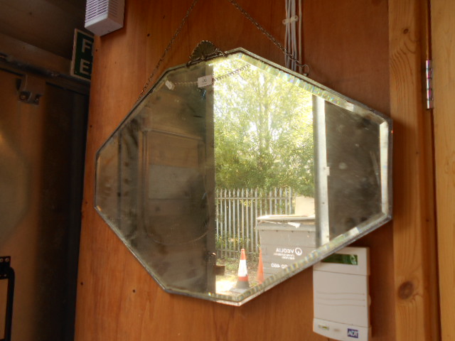An Art Deco octagonal bevelled edge wall mirror