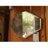 An Art Deco octagonal bevelled edge wall mirror