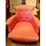 A pink upholstered tub shaped salon chair raised on squat cabriole shaped supports