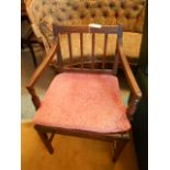 An early 20th C oak open armchair