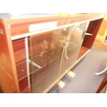 A mahogany effect shop display counter, the front having glazed doors and adjustable shelves,