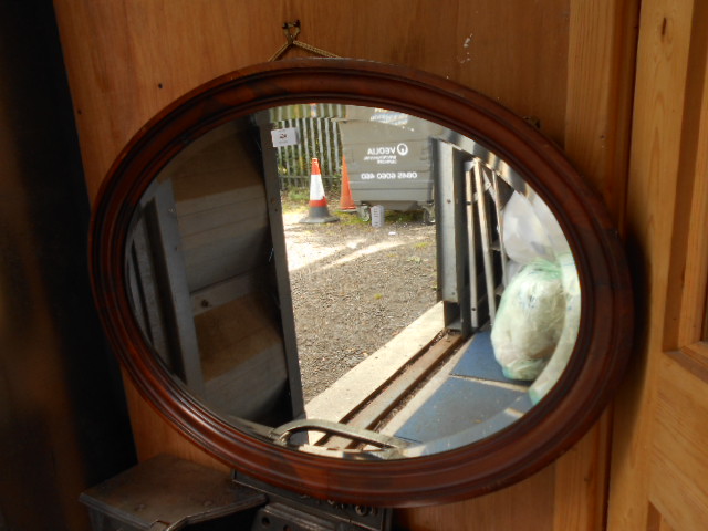 A Victorian mahogany oval mirror