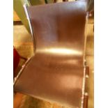 A contemporary Continental chrome and tan leather designer chair