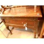 A late 18th C oak lowboy the later moulded top over a single drawer and raised in cabriole shaped