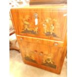 A 1940's/50's Japanned walnut cocktail cabinet decorated with hand painted figures,