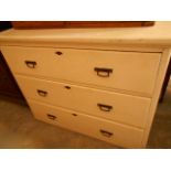 A late 19th C / early 20th C white painted chest of three long drawers each with brass swing