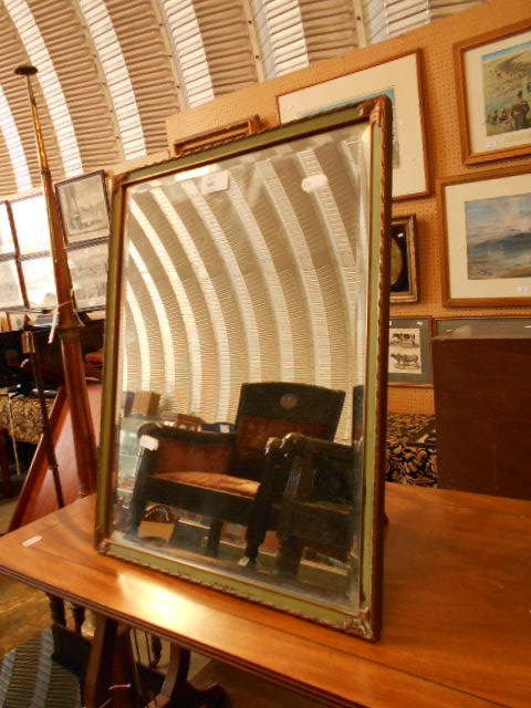 A bevelled glass painted and gilt framed standing mirror