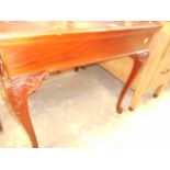 A mahogany centre table having acanthus carved cabriole legs