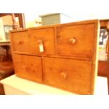 A late 19thC pine five drawer table-top chest