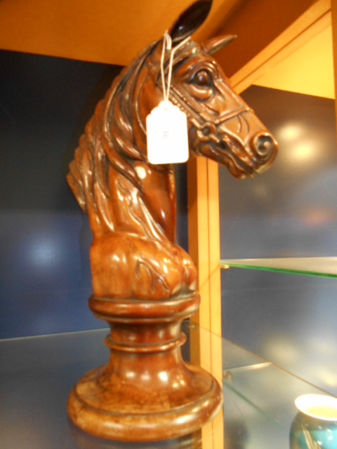 A carved wooden horse's head