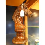 A carved wooden horse's head