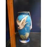 A mid 20th C Midwinter Burslem blue ground vase of ovoid form hand-painted with a bird in flight