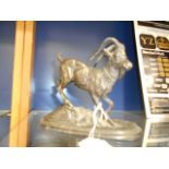 A late 19th C spelter figure of a mountain goat on a rocky stylised base