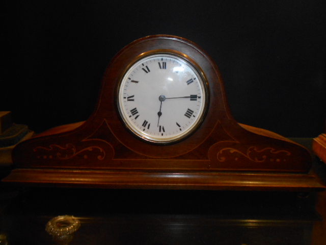 An Edwardian inlaid walnut cased dome top mantel clock with white enamel dial and Roman numerals