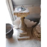 A 20th C reconstituted stone sundial of baluster form with bronze sun engraved dial raised on a