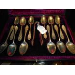 A boxed set of twelve Sheffield 1893 silver teaspoons and sugar tongs