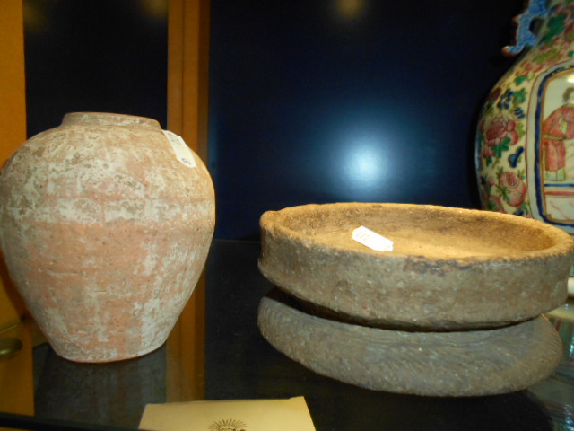 An early South East Asian circular footed bowl together with a terracotta vase of ovoid form both
