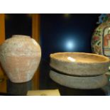 An early South East Asian circular footed bowl together with a terracotta vase of ovoid form both