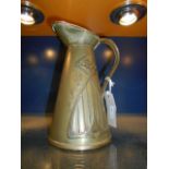 A Joseph Sankey brass Art Nouveau jug embossed with tulips