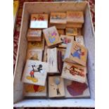 A box of wooden and rubber craft stamps to include Walt Disney characters