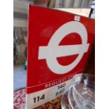 A double sided enamel London Bus request stop sign