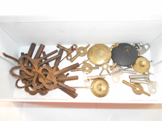 A collection of vintage clock and watch keys
