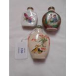 Three Chinese snuff bottles, one decorated with butterflies and signed to base,