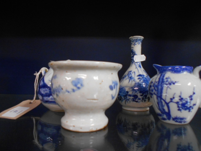 A 19th C Chinese blue and white teapot, a Chinese blue and white bottle vase,