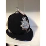 A vintage six panel design Devon & Cornwall Constabulary police helmet with chrome badge and ball