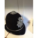 A vintage two panel design Lancashire Constabulary police helmet with chrome badge and rose finial,