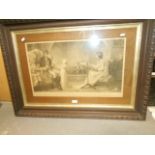 A large antique engraving of a young family by the fire,