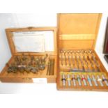 Two cased sets of Bergeon mainspring winders of varying sizes and precision screw drivers and bits