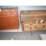 Two vintage hessian and leather bound suitcases together with a tan leather suitcase all with