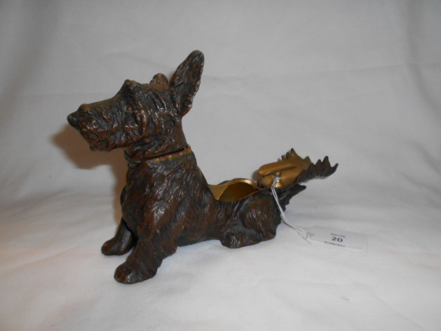 A cast metal smokers companion in the form of a Scottie dog