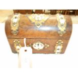A burr walnut domed top casket with ornate brass and Ivorine escutcheons,